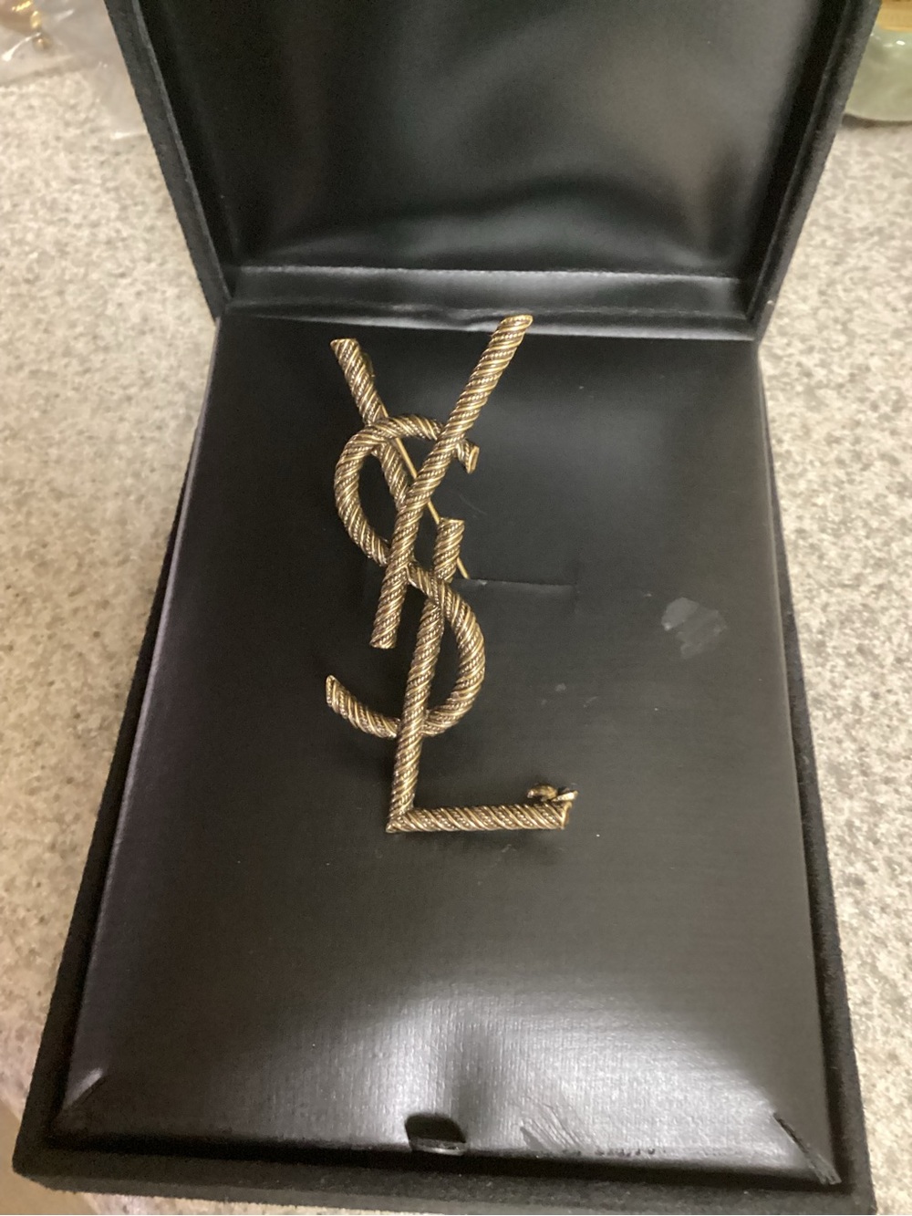 Yves Saint Laurent Twisted Rope Monogram Brooch in Gold Tone